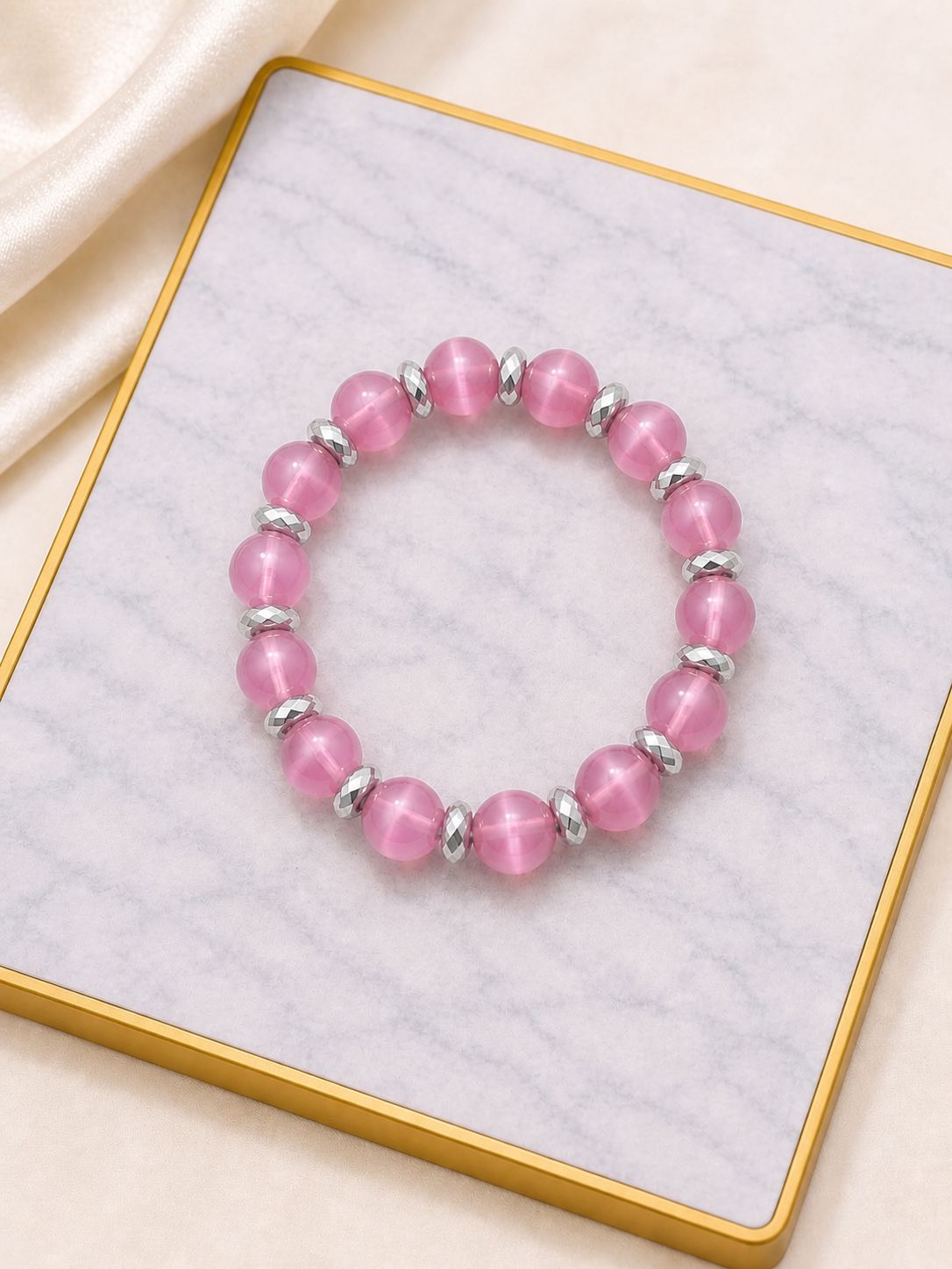 Pink cat eye with gold spacers
